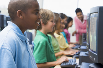 Image: Children sitting in front of computers